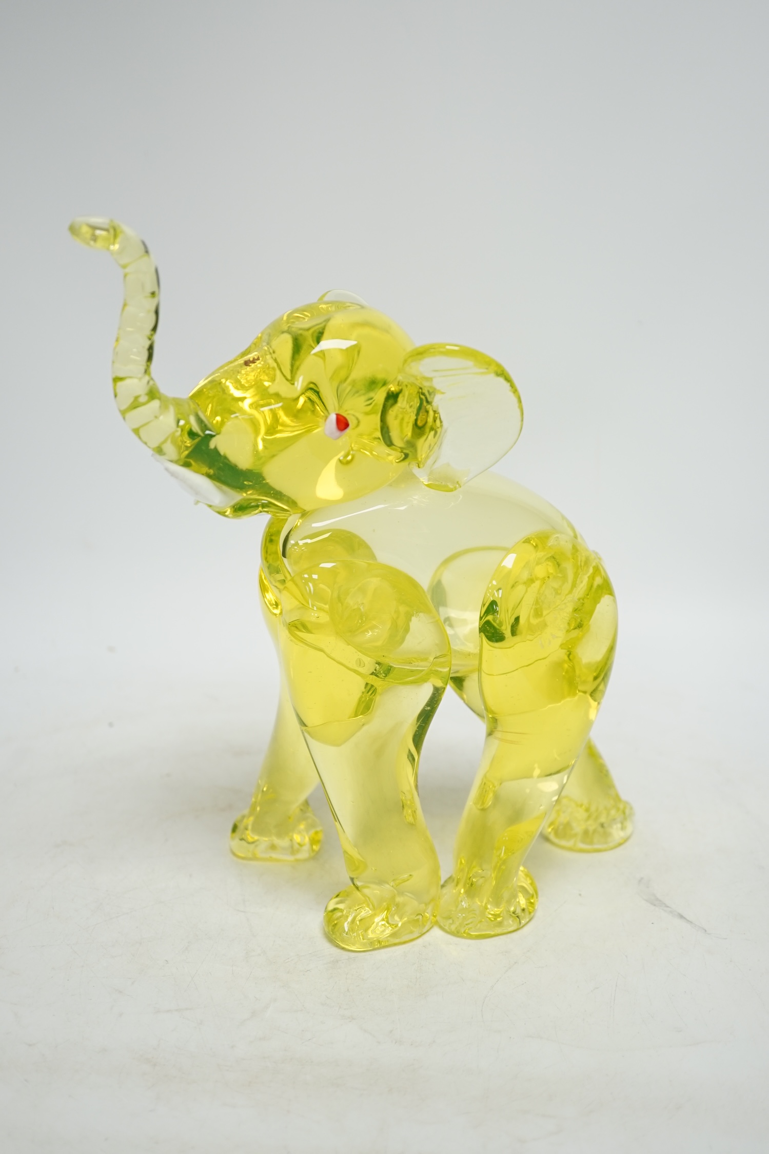 A Murano uranium glass model of an elephant, 26cm. Condition - good.